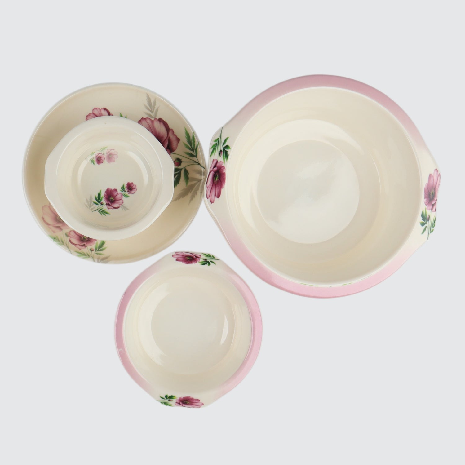 Set of ceramic bowls with floral design on a white background