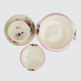 Set of ceramic bowls with floral design on a white background