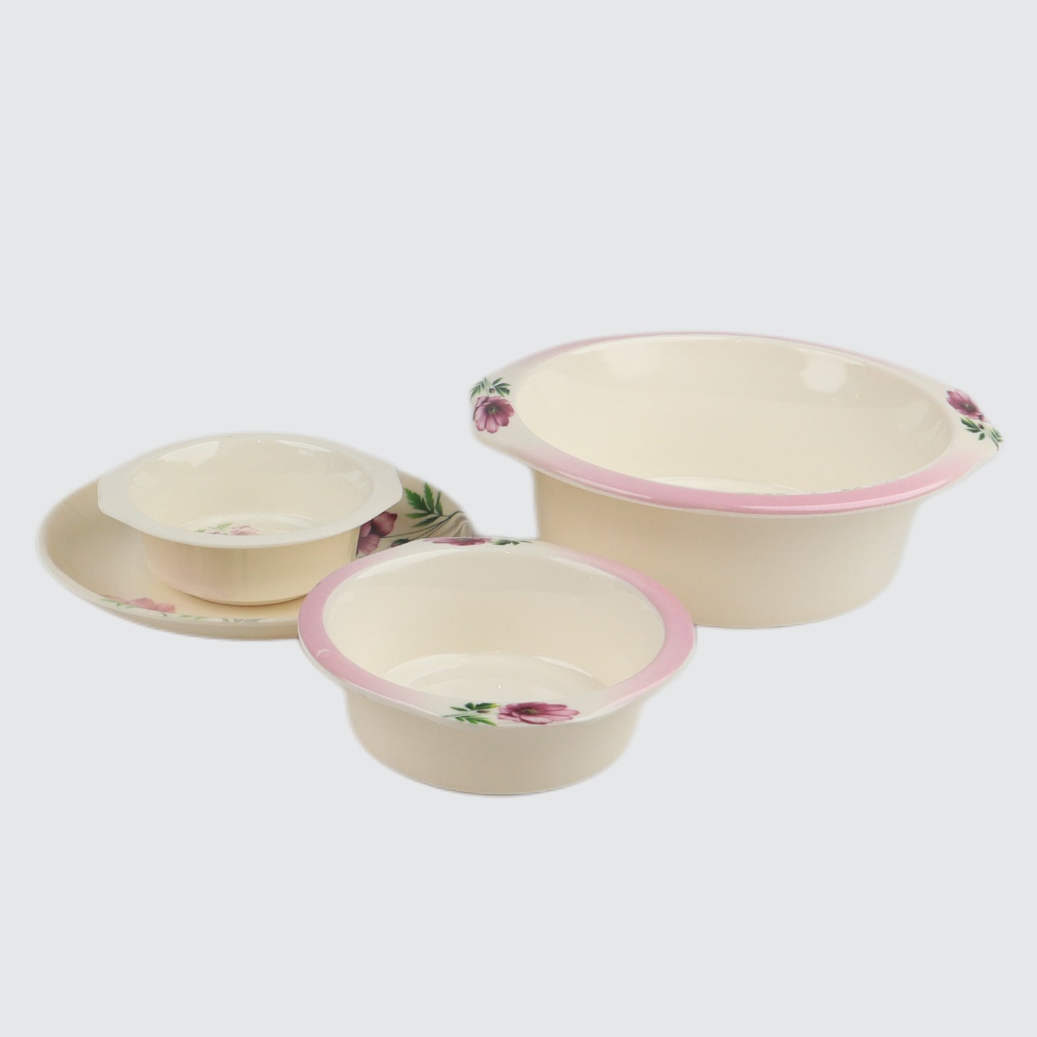 Set of three ceramic bowls with floral patterns on a white background