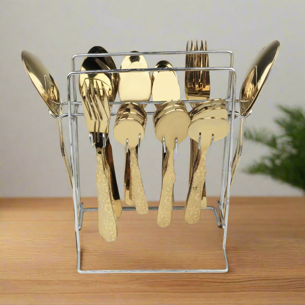 Gold cutlery set in a clear stand on a light gray background at affordable price from best cookware brand in Pakistna