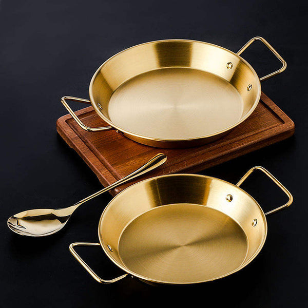 Two gold-finish stainless steel pans with side handles, shown in different sizes