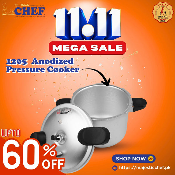 Anodized aluminum pressure cooker with short black handles and a separate lid