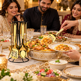 Gold serving spoons set with stand, shown at a dinner table with serving utensils