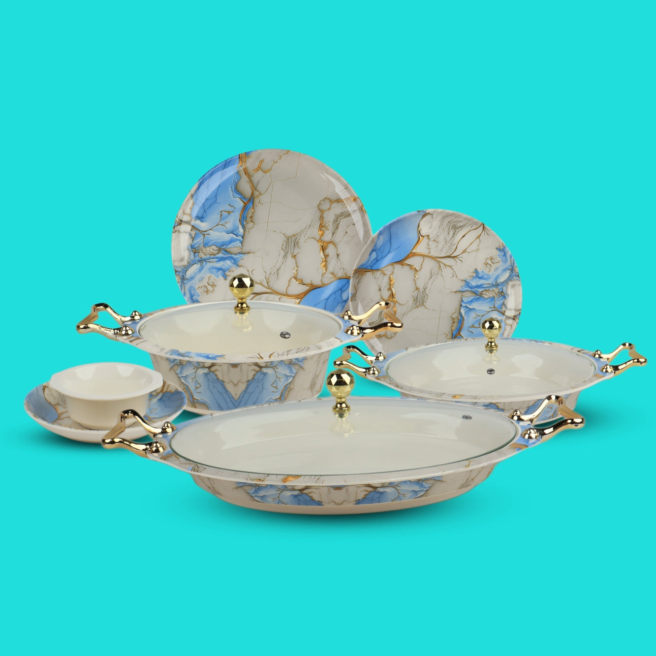 Set of ceramic dishes with marble-like design and gold accents on a turquoise background